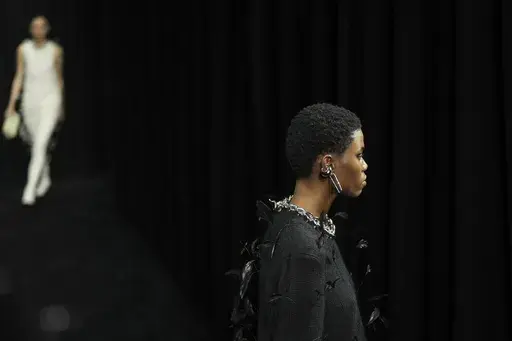 A model wears a creation of the Jil Sander Fall/Winter 2025-2026 women's collection presented in Milan, Italy, Wednesday, Feb. 26, 2025. (AP Photo/Antonio Calanni)