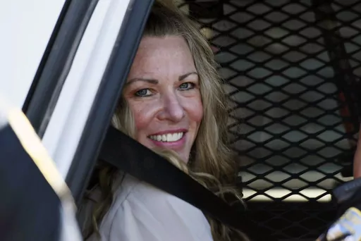 Lori Vallow Daybell sits in a police car after a hearing at the Fremont County Courthouse in St. Anthony, Idaho, on Aug. 16, 2022. The sister of Tammy Daybell, who was killed in what prosecutors say was a doomsday-focused plot, told jurors Friday, April 28, 2023, that her sister's funeral was held so quickly that some family members couldn't attend. The testimony came in the triple murder trial of Vallow Daybell, who is accused along with Chad Daybell in Tammy's death and the deaths of Vallow Da