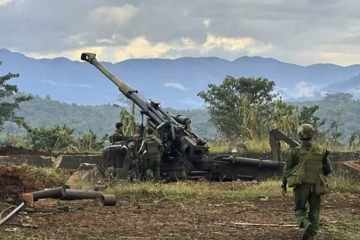 In this photo provided by the Kokang online media, members of an ethnic armed forces group, one of the three militias known as the Three Brotherhood Alliance, check weapons the group allegedly seized from Myanmar's army outpost on a hill in Hsenwi township in Shan state, Myanmar, on Nov. 24, 2023. A major offensive against Myanmar's military-run government by an alliance of three militias of ethnic minorities has been moving at lightning speed, inspiring resistance forces around the country to a