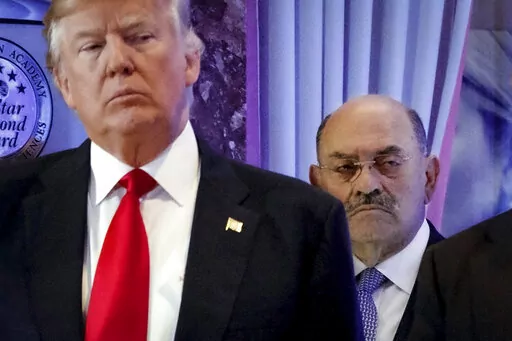 Allen Weisselberg, right, stands behind then President-elect Donald Trump during a news conference in the lobby of Trump Tower in New York, Jan. 11, 2017. Weisselberg, Trump's chief financial officer, is expected to plead guilty on Thursday, Aug. 18, 2022 to tax violations in a deal that would require him to testify about business practices at the former president's company. (AP Photo/Evan Vucci, File)