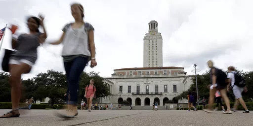 In this Sept. 27, 2012, file photo, students walk through the University of Texas at Austin campus near the school's iconic tower in Austin, Texas. A ban on diversity, equity and inclusion initiatives in higher education has led to more than 100 job cuts across university campuses in Texas, a hit echoed or anticipated in numerous other states where lawmakers are rolling out similar policies during an important election year. (AP Photo/Eric Gay, File)