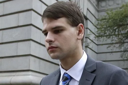Nathan Carman leaves federal court in Providence, R.I., Aug. 21, 2019. An autopsy has determined that Carman's death while he was awaiting trial on charges of killing his mother off the coast of New England in a scheme to inherit millions of dollars was not suspicious, the New Hampshire attorney general's office said Wednesday, June 28, 2023. Twenty-nine-year-old Carman was found dead in his cell in a county jail in New Hampshire on June 15. (AP Photo/Steven Senne, File)