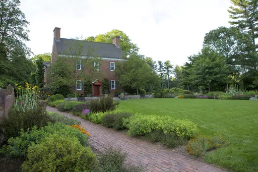 This image provided by Mt. Cuba Center shows the formal native plant garden blooming at the botanical garden, located in Hockessin, Del. Plantings depicted are: Amsonia tabernaemontana 'Storm Cloud', Asclepias tuberosa, Coreopsis verticillata 'Crazy Cayenne', Gillenia trifoliata 'Pink Profusion', Monarda didyma 'AChall', Penstemon 'Dark Towers', Physocarpus opulifolius 'SMPOTW', Rudbeckia maxima, Sisyrinchium angustifolium 'Lucerne', Solidago sphacelata 'Golden Fleece' and Symphyotrichum oblongi
