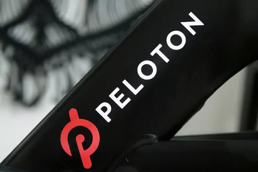 A Peloton logo is seen on the company's stationary bicycle on Nov. 19, 2019, in San Francisco, Calif. Peloton is recalling more than 2 million of its exercise bikes because the bike’s seat post assembly can break during use, posing fall and injury hazards. (AP Photo/Jeff Chiu, File)