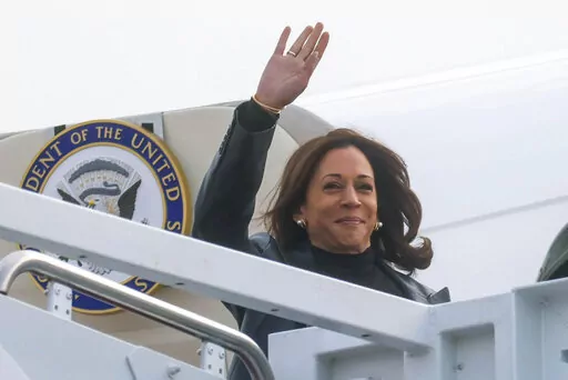 Vice President Kamala Harris boards Air Force 2 for travel to Japan and South Korea from Joint Base Andrews, Maryland, Sunday Sept. 25, 2022. (Leah Millis/Pool via AP)