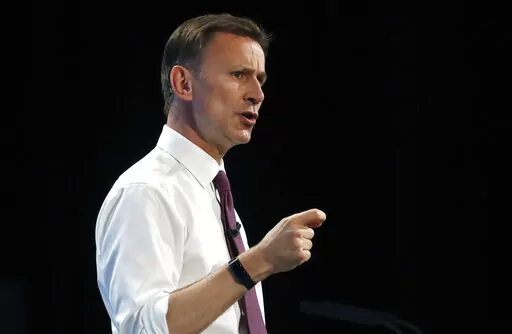 Conservative party leadership candidate Jeremy Hunt takes delivers his speech during a Conservative leadership hustings at ExCel Centre in London, Wednesday, July 17, 2019. UK leader Liz Truss has appointed former Cabinet minister Jeremy Hunt as new Treasury chief, replacing sacked Kwasi Kwarteng. Hunt is a government veteran who has served as former foreign secretary and health secretary, and ran unsuccessfully to lead the Conservative Party in 2019. (AP Photo/Frank Augstein, File)