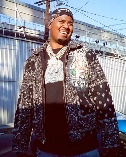 In this March 2021 photo provided by Scott Jawson, West Coast rapper Drakeo the Ruler is seen outside a recording studio in Los Angeles. Drakeo the Ruler, whose real name was Darrell Caldwell, was fatally stabbed in an altercation at a Los Angeles music festival Saturday, Dec. 18, 2021. His publicist confirmed the death to the New York Times. The 28-year-old was assaulted at the Once Upon a Time in LA concert Saturday night. (Wyatt Winfrey/Courtesy of Scott Jawson via AP)