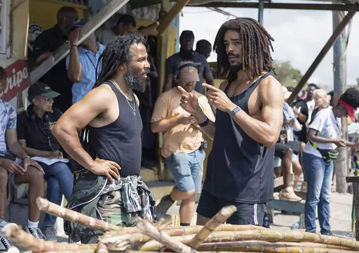 This image released by Paramount Pictures shows producer Ziggy Marley, left, and Kingsley Ben-Adir on the set of "Bob Marley: One Love." (Chiabella James/Paramount Pictures via AP)