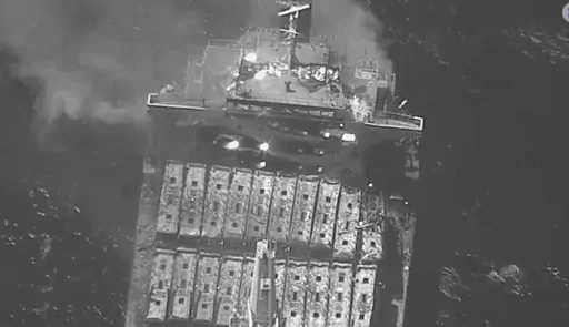 This black-and-white image released by the U.S. military's Central Command shows the fire aboard the bulk carrier True Confidence after a missile attack by Yemen's Houthi rebels in the Gulf of Aden on Wednesday, March 6, 2024. A missile attack by Yemen's Houthi rebels on a commercial ship in the Gulf of Aden on Wednesday killed three of its crew members and forced survivors to abandon the vessel, the U.S. military said. It was the first fatal strike in a campaign of assaults by the Iranian-backe
