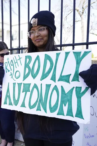 Pradnya Jagdale, a former Jackson abortion clinic escort, stands with a small group of protestors before the Mississippi Governor's Mansion in Jackson, Friday, Jan. 20, 2023. The abortion rights advocates demonstrated at the building's gates, countering the national March For Life gatherings, while carrying signs calling for abortion rights. A state law banning most abortions, went into effect July 7, 2022. (AP Photo/Rogelio V. Solis)