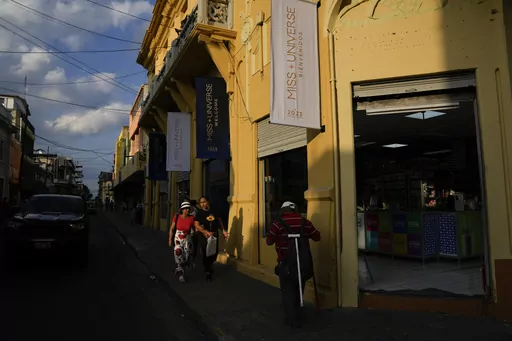 Banners promoting the Miss Universe Pageant hang from a building in downtown San Salvador, El Salvador, Friday, Nov. 17, 2023. El Salvador hosts the 72nd Miss Universe Beauty Pageant. The pageant is the latest spectacle touted by President Nayib Bukele in his efforts to change the reputation of his historically violence-torn nation. (AP Photo/Moises Castillo)