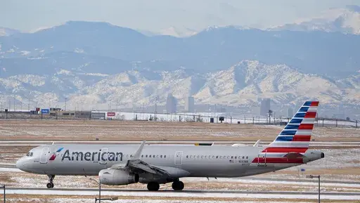 An American Airlines jetliner rumbles down a runway at Denver International Airport, Jan. 16, 2024, in Denver. (AP Photo/David Zalubowski, File)