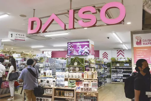 Shoppers visit a Daiso shop as the shop opened to the media in Tokyo, on April 13, 2022. Hirotake Yano, who founded the retail chain Daiso known for its 100-yen shops, Japan’s equivalent of the dollar store, has died. He was 80.(Kyodo News via AP)
