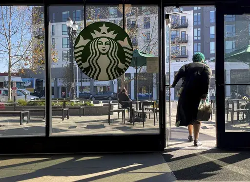 A costumer exits a Starbucks store in Oakland, Calif., Jan. 16, 2025. (AP Photo/Godofredo A. Vásquez, File)