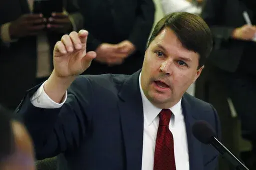 Cliff Johnson, director of the Roderick and Solange MacArthur Justice Center at the University of Mississippi School of Law, is shown speaking to state lawmakers about prisons in this Feb. 13, 2020 file photograph, at the Mississippi State Capitol. A report released by the center on Jan. 12, 2022, says thousands of people in Mississippi are held in county jails for long periods while waiting to go on trial because they are too poor to afford bail, judges may deny bail altogether or public defend