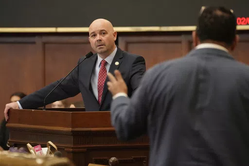 Mississippi Rep. Cedric Burnett, D-Tunica, right, asks a question of Mississippi House Gaming Committee Chairman Casey Eure, R-Saucier, regarding the Mississippi Mobile Sports Wagering Act, Feb. 1, 2024, during floor debate in the House of Representatives at the state Capitol in Jackson, Miss. Mobile sports betting will remain illegal in Mississippi after legislative negotiators failed to advance a final proposal Monday, April 29. (AP Photo/Rogelio V. Solis, File)