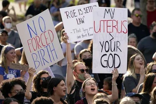 Abortion-rights protesters attend a rally, June 24, 2022, in Des Moines, Iowa. Iowa’s strict abortion law will take effect Monday, July 29, 2024, banning most abortions after about six weeks of pregnancy and before many women know they are pregnant. (AP Photo/Charlie Neibergall, File)