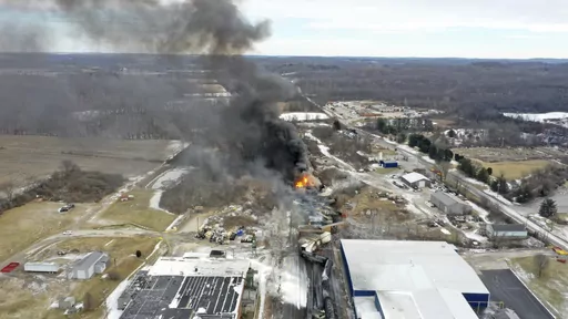 This photo taken with a drone shows portions of a Norfolk and Southern freight train that derailed Friday night in East Palestine, Ohio are still on fire at mid-day Saturday, Feb. 4, 2023. The federal government filed a lawsuit Thursday, March 30, against railroad Norfolk Southern over environmental damage caused by a February derailment on the Ohio-Pennsylvania border that spilled hazardous chemicals into nearby creeks and rivers. (AP Photo/Gene J. Puskar, File)