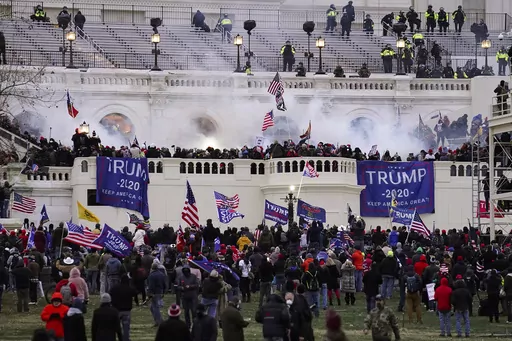 People loyal to President Donald Trump storm the U.S. Capitol on Jan. 6, 2021, in Washington. Federal authorities say a Southern California man who assaulted police with pepper spray during the storming of the U.S. Capitol was sentenced to 4 1/2 years in prison. The U.S. Department of Justice said in a statement Friday, April 28, 2023, that Jeffrey Scott Brown of Santa Ana, Calif., received a sentence of 54 months. (AP Photo/John Minchillo, File)