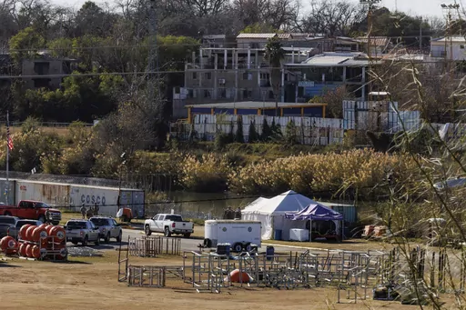 Texas Department of Public Safety officers work inside a fenced off Shelby Park, Thursday, Jan. 11, 2024, in Eagle Pass, Texas. The Justice Department on Friday, Jan. 12, asked the Supreme Court to order Texas to stop blocking Border Patrol agents from a portion of the U.S.-Mexico border where large numbers of migrants have crossed in recent months, setting up another showdown between Republican Gov. Greg Abbott and the Biden administration over immigration enforcement. (Sam Owens /The San Anton