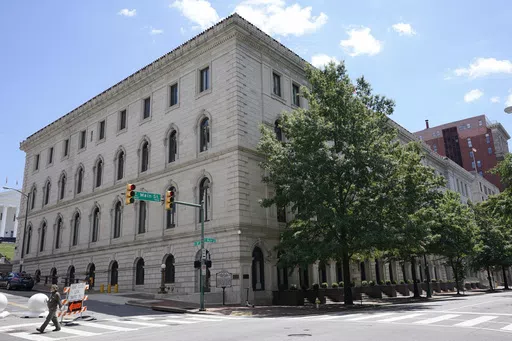 A pedestrian passes by the US 4th Circuit Court of Appeals Courthouse on Main Street in Richmond, Va., Wednesday, June 16, 2021. In a ruling Tuesday, April, April 16, 2024, a federal appeals court has overturned a West Virginia transgender sports ban, finding that the law violates Title IX, the federal civil rights law that prohibits sex-based discrimination in schools. (AP Photo/Steve Helber, File)