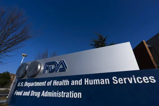 A sign in front of the Food and Drug Administration building is seen on Dec. 10, 2020, in Silver Spring, Md. U.S. health officials are alerting consumers about two more recalls of eyedrops due to contamination risks that could lead to vision problems and serious injury. (AP Photo/Manuel Balce Ceneta, File)