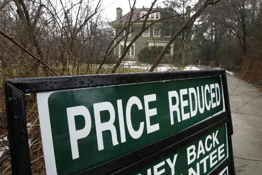 In a Feb. 16, 2012 photo, an existing home is seen for sale in Shaker Heights, Ohio. More homeowners eager to sell their home are lowering their initial asking price in a bid to entice prospective buyers as the spring homebuying season gets going. Some 14.6% of U.S. homes listed for sale last month had their price lowered, according to Realtor.com. That’s up from 13.2% a year earlier, the first annual increase since May, 2023. (AP Photo/Amy Sancetta, file)