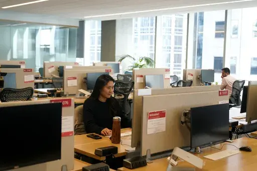 People work at the Yelp office in San Francisco on Feb. 14, 2023. Remote work has intensified loneliness in the workplace. Experts say friendships and a sense of belonging are vital to employees’ happiness. And also to companies’ success. (AP Photo/Jeff Chiu, File)