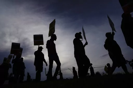 UPS teamsters and workers hold a rally, Friday, July 21, 2023, in Atlanta, as a national strike deadline nears. UPS has reached a contract agreement with its 340,000-person strong union Tuesday, July 25, averting a strike that had the potential to disrupt logistics nationwide for businesses and households alike. (AP Photo/Brynn Anderson, File)