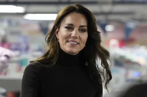 Britain's Kate, Princess of Wales smiles during her visit to Sebby's Corner in north London, Friday, Nov. 24, 2023. Princess Kate apologized Monday, March 11, 2024 for “confusion” caused by her editing of a family photo released by the palace — an image of the British royal and her children that was intended to calm concern and speculation about the princess's health, but had the opposite effect. (AP Photo/Frank Augstein, Pool, File )