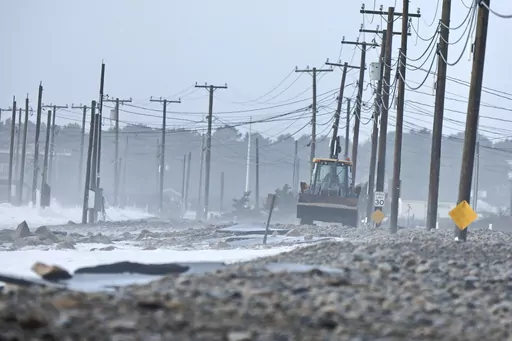 The remnants of East Beach Road are damaged after heavy overnight winds and surf battered the coastline, Wednesday, Jan. 10, 2024 in Westport, Mass. Salisbury, Mass., is scrambling after a weekend storm washed away mountains of sand trucked in for nearly $600,000 dune that was meant to protect homes, roads and other infrastructure. The community and other areas of Massachusetts also were hit by severe storms in January, including flooding, erosion, and infrastructure damage. (Peter Pereira/The S