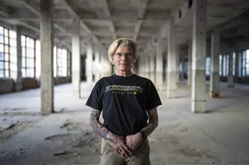 Ukrainian medic Yuliia Paievska, known as Taira, poses for a photograph during an interview with The Associated Press in Kyiv, Ukraine, on Friday, July 8, 2022. The celebrated Ukrainian medic who was held captive by Russian forces says she thinks about the prisoners she left behind constantly. Before she was captured, Paievska had recorded harrowing bodycam footage showing her team's efforts to save the wounded in the besieged city of Mariupol. (AP Photo/Evgeniy Maloletka)