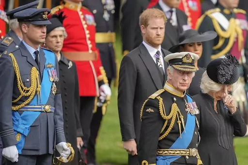 King Charles III, front right, Camilla, the Queen Consort, Prince Harry and Prince William watch as the coffin of Queen Elizabeth II is placed into the hearse following the state funeral service in Westminster Abbey in central London Monday Sept. 19, 2022. King Charles III has been diagnosed with a form of cancer and has begun treatment, Buckingham Palace says on Monday, Feb. 5, 2024. (AP Photo/Martin Meissner, Pool, File)