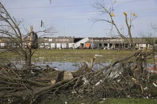The broken and damaged trees along U.S. Hwy 45 South are covered with metal and other materials that were ripped off the nearby Cooper Tire and Rubber Company, on April 1, 2023, in Tupelo, Miss. Production at the large north Mississippi tire plant has ground to a halt in the wake of a damaging tornado, halting operations at the second-largest production facility for Goodyear’s North American network. (Thomas Wells/The Northeast Mississippi Daily Journal via AP, File)