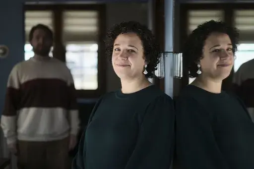 Hannah Jones, accompanied by her spouse, Steve Cook, pose for a portrait at home near Philadelphia, Wednesday, March 12, 2025. (AP Photo/Matt Rourke)