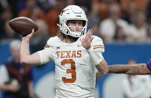 Texas quarterback Quinn Ewers (3) looks to pass against Washington during the second half of the Alamo Bowl NCAA college football game in San Antonio, Thursday, Dec. 29, 2022. Texas wraps spring practice Saturday with the Longhorns' annual scrimmage, allowing the first real look at the biggest quarterback battle in the Big 12 between Ewers, early-enrolled freshman Arch Manning of the famed football family, and second-year reserve Maalik Murphy, a top recruit who spent his freshman season of 2022