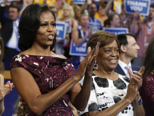 First lady Michelle Obama, left, and her mother Marian Robinson react as Ret. Navy Admiral John B. Nathman speaks to delegates at the Democratic National Convention in Charlotte, N.C., Sept. 6, 2012. Robinson, who moved with the first family to the White House when son-in-law Barack Obama was elected president, has died, according to an announcement by Michelle Obama and other family members Friday, May 31, 2024. (AP Photo/Charles Dharapak, File)