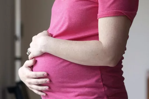 A pregnant woman stands for a portrait in Dallas, Thursday, May 18, 2023. On Friday, Aug. 4, 2023, U.S. health officials approved the first pill, Zurzuvae, specifically intended to treat severe depression after childbirth, a condition that affects thousands of new mothers in the U.S. each year. (AP Photo/LM Otero, File)