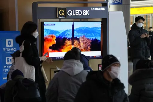 People watch a TV showing an image of North Korea's missile launch during a news program at the Seoul Railway Station in Seoul, South Korea, Monday, Jan. 31, 2022. North Korea confirmed Monday it test-launched an intermediate-range ballistic missile capable of reaching the U.S. territory of Guam, the North's most significant weapon launch in years, as Washington plans to respond to demonstrate it's committed to its allies' security in the region. (AP Photo/Ahn Young-joon)