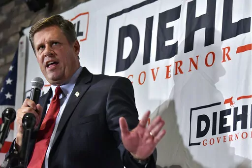 Massachusetts Republican gubernatorial candidate Geoff Diehl speaks to reporters at his primary night victory party, Tuesday, Sept. 6, 2022, in Weymouth, Mass. Diehl, a former GOP state representative from Whitman, Mass. endorsed by Donald Trump, beat businessman Chris Doughty for the chance to replace incumbent Republican Gov. Charlie Baker, who's opted not to seek a third term. (AP Photo/Josh Reynolds)
