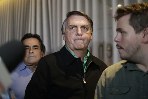 Brazil's former President Jair Bolsonaro prepares to speak to the press at a restaurant in Belo Horizonte, Brazil, June 30, 2023, the day that judges ruled him ineligible to run for any political office again until 2030 after concluding that he abused his power and cast unfounded doubts on the country's electronic voting system. (AP Photo/Thomas Santos, File)