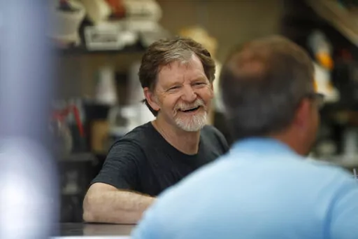 Baker Jack Phillips, owner of Masterpiece Cakeshop in Lakewood, Colo., manages his shop, June 4, 2018, after the U.S. Supreme Court ruled that his refusal to make a wedding cake for a same-sex couple because of his religious beliefs did not violate Colorado's anti-discrimination law. Now, the Colorado baker is challenging a separate ruling that he violated the state's anti-discrimination law by refusing to make a cake celebrating a gender transition. (AP Photo/David Zalubowski, File)