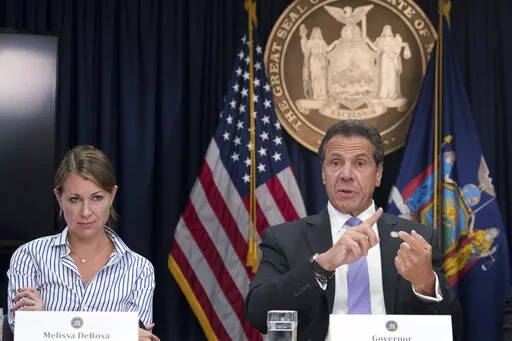 Secretary to the Governor Melissa DeRosa, left, joins New York Gov. Andrew Cuomo as he speaks to reporters during a news conference on Sept. 14, 2018, in New York. A New York state trooper who testified that former Gov. Andrew Cuomo sexually harassed her filed a lawsuit Thursday, Feb. 17, 2022, and asked a federal court to declare that Cuomo, a top aide and state police violated her civil rights. The trooper, whose name was not disclosed in the lawsuit, filed the suit in Manhattan against Cuomo,