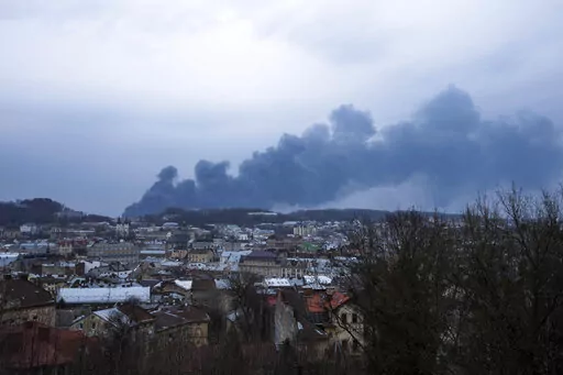 Smoke rises in the sky in Lviv, western Ukraine, Saturday, March 26, 2022. With Russia continuing to strike and encircle urban populations, from Chernihiv and Kharkiv in the north to Mariupol in the south, Ukrainian authorities said Saturday that they cannot trust statements from the Russian military Friday suggesting that the Kremlin planned to concentrate its remaining strength on wresting the entirety of Ukraine's eastern Donbas region from Ukrainian control. (AP Photo/Nariman El-Mofty)