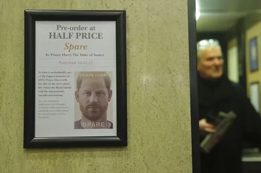 A promotional poster of the new book "Spare"is displayed in a bookstore in London, Thursday, Jan. 5, 2023. Prince Harry alleges in a much-anticipated new memoir that his brother Prince William lashed out and physically attacked him during a furious argument over the brothers' deteriorating relationship, The Guardian reported Thursday. The newspaper said it obtained an advance copy of the book, "Spare," due to be published next week. (AP Photo/Kin Cheung)