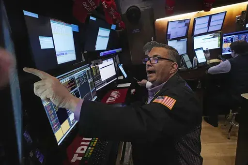 Trader Jonathan Mueller works on the floor of the New York Stock Exchange, Tuesday, Feb. 4, 2025. (AP Photo/Richard Drew)