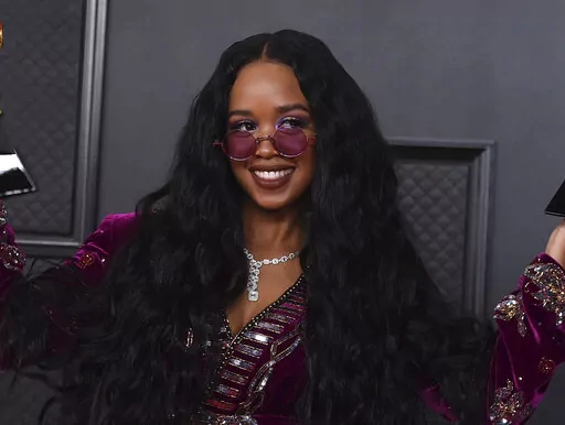 H.E.R. appears at the 63rd annual Grammy Awards in Los Angeles on March 14, 2021. The four-time Grammy winner will embark on her 19-city Back of My Mind tour in early April while separately joining Coldplay for their world tour as a supporting act later this month. (Photo by Jordan Strauss/Invision/AP, File)