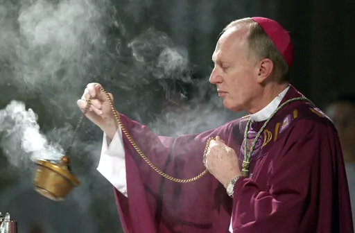 Bishop Howard Hubbard swings incense during an Ash Wednesday communion service at the Cathedral of the Immaculate Conception on Feb. 25, 2004, in Albany, N.Y. Hubbard, now retired and who has admitted to covering up for predator priests and has himself been accused of sexual abuse, has asked Pope Francis to laicize him, or remove him from the priesthood. Hubbard, 84, announced the decision in a statement Friday, Nov. 18, 2022, the day the United Nations has designated as the World Day for Previo