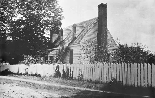 FILE- This early 1900s photo provided by the The Colonial Williamsburg Foundation shows the front of the Dudley Digges House in its original location on Prince George Street, in Williamsburg, Va. The Andrew W. Mellon Foundation has given a $5-million boost to efforts to preserve the colonial-era schoolhouse where enslaved and free Black children were taught in Virginia, officials announced Friday, Feb. 18, 2022.   (Courtesy of John D. Rockefeller Jr. Library/The Colonial Williamsburg Foundation