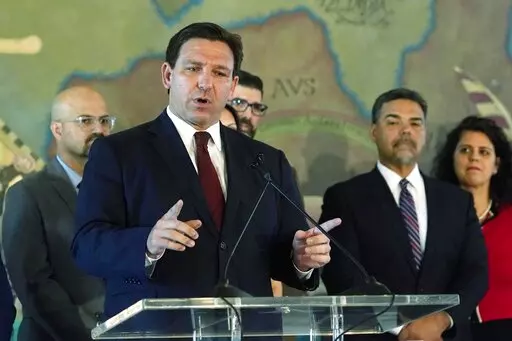 Florida Gov. Ron DeSantis speaks at Miami's Freedom Tower, on Monday, May 9, 2022, in Miami. A congressional map approved by DeSantis and drawn by his staff is unconstitutional because it breaks up a district where Black voters can choose their representatives, a state judge said Wednesday, May 11, 2022. (AP Photo/Marta Lavandier, File)